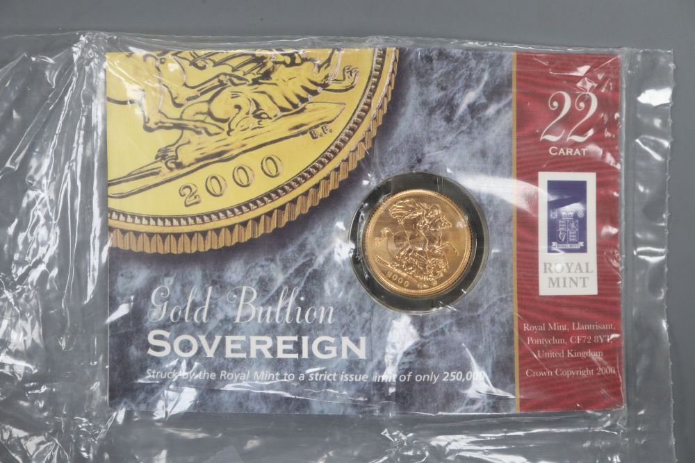 A 2000 gold sovereign, in Royal Mint packet.